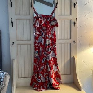 Fun red floral jumpsuit with wide flared legs, shirred bodice w/ shoulder ties